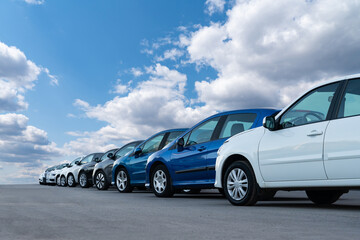 A lot of cars in a rows. Used car sales