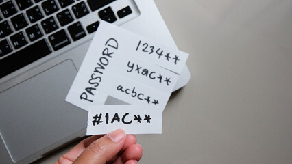 password, mail, bank, facebook, message concept written post it on laptop keyboard.	