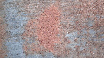 Rust on the iron door for the background. old peeling paint on rusty grates. Rusty metal texture.