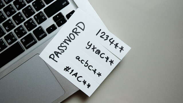 password, mail, bank, facebook, message concept written post it on laptop keyboard.