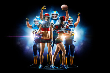 Naklejka premium Professional american football players male and female posing together isolated on the black background