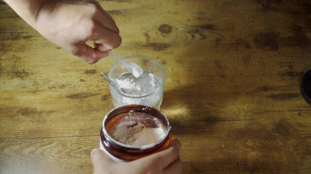 Athlete preparing creatine supplement drink