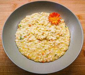 Detail of an Italian marigold risotto with decorative flower
