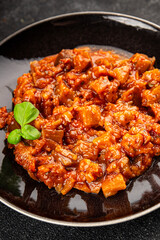 Eggplant stew dish vegetables salad tasty fresh delicious gourmet food background on table rustic food top view copy space keto and paleo diet vegetarian and vegan food