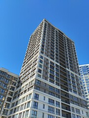 Obraz premium A modern apartment building. Urban residential complex. High-rise apartment building