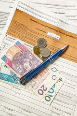 Close-up. Background. PIT-37. Polish tax return form for 2024 (called PIT) with pen and money