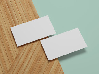 Unique business card arrangement on a mint green and wood backdrop, perfect for contemporary branding ideas.