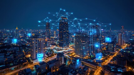 Fototapeta premium Cityscape at night with digital network overlay. Possible use Stock photo for technology, innovation, urban design