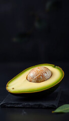 Single Avocado Half on Black Slate