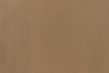 Detailed texture of recycled brown kraft cardboard, close-up view