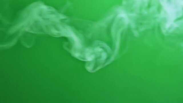 Slow motion smoke video on green background