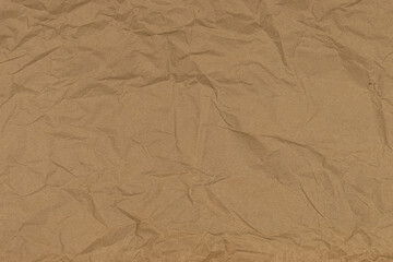Detailed texture of brown eco-friendly recycled paperboard, close-up view