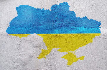 map of Ukraine painted on an old wall with the colors blue and yellow of the flag
