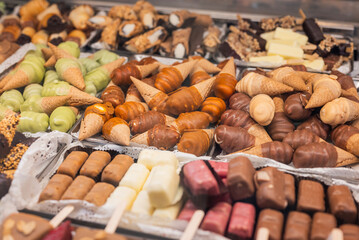 display case in a cafe with different types of gelato ice cream in Italy