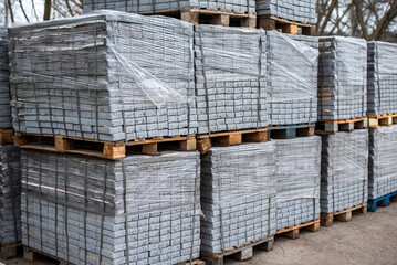 Pavement Concrete Tiles at Pallet Construction Site. Urban construction, paving slabs