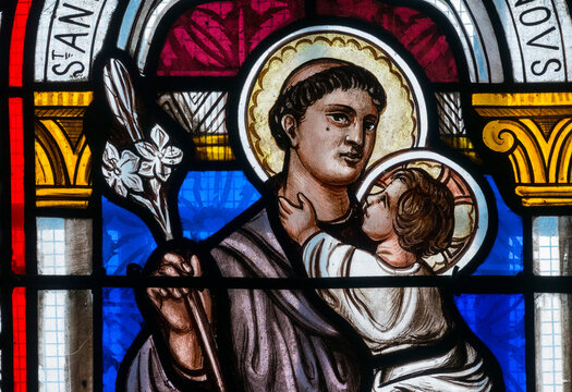 Stained glass (19th century) of Saint Anthony of Padua or Saint Antoine de Padoue holding baby Jesus