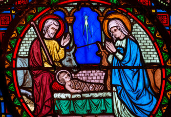 Fototapeta premium Stained glass (19th century) of Christmas Nativity Scene with Virgin Mary, Saint Joseph, and Jesus baby.