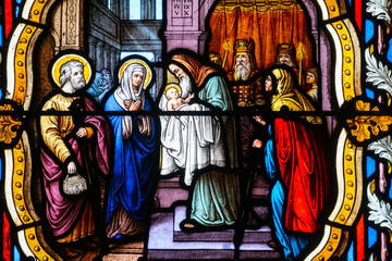Fototapeta premium Stained glass (19th century) of The childhood of Jesus: Presentation of Jesus at the Temple.