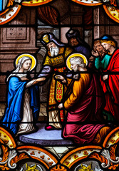 Fototapeta premium Stained glass (19th century) of Holy family: The wedding of Mary and Joseph.