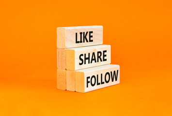 Like share follow symbol. Concept words Like Share Follow on beautiful wooden blocks. Beautiful orange table orange background. Business like share follow concept. Copy space.