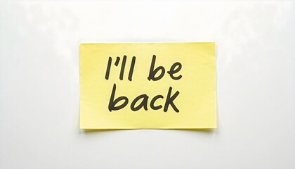 A bright yellow sticky post it note displays the phrase “I’ll be back.”