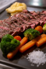 Medium rare rib eye angus steak served on plate