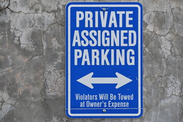 Obraz premium Private parking sign, blue in color, multi directional arrow.