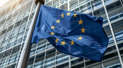 European union flag waving outside modern glass building