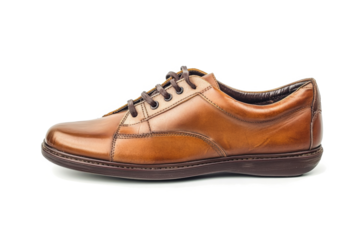 a brown leather shoe with a brown sole cutout image and isolated on transparent background 