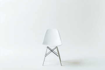 a white chair with a metal base cutout image and isolated on transparent background 