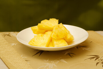 Cut pineapple on a simple background