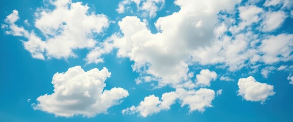 Vast blue sky canvas dotted with fluffy white cumulus clouds, expanse, landscape