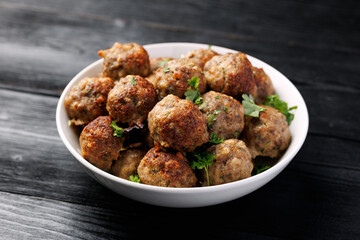 Homemade beef and pork meatballs on baking paper