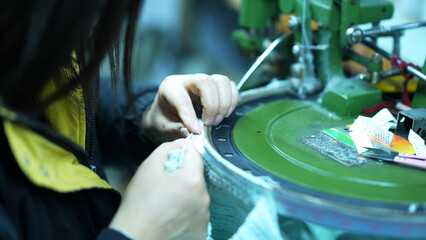Overlock machines in a woolen sweater factory