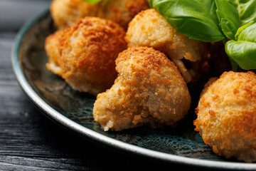 Crispy Breaded Garlic Mushrooms with garlic sauce. Vegetarian, vegan food concept