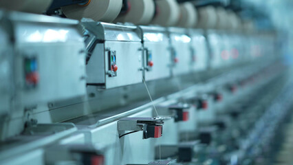 Cone winders in a woolen sweater factory