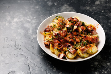 Octopus tentacles and new potatoes warm salad with smoked paprika dressing
