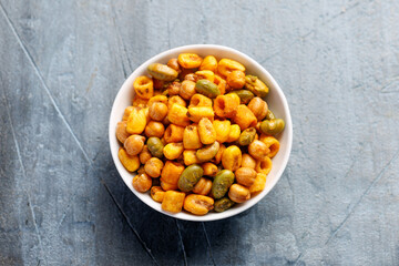 Sweet chilli Crunch protein packed mix of baked corn pieces, edamame beans, chickpeas and corn hoops. Healthy snack concept