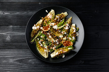 Grilled little gem lettuce with aioli sauce, roasted pine nuts and chilli flakes. Healthy Low carb side salad