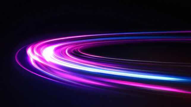 Colorful light trails create an abstract glow in a dark setting during nighttime activities