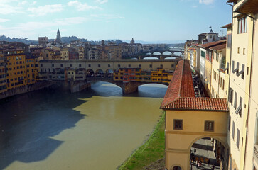 Old Bridge called ponte vecchio and vasari corridor span the arno river a historic florentine view