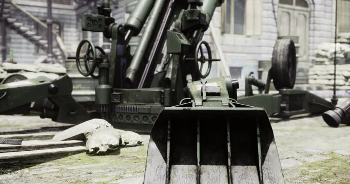 Heavy artillery stands ready in a military compound, showcasing detailed machinery and equipment against a backdrop of historic structures. The setting emphasizes tactical readiness.