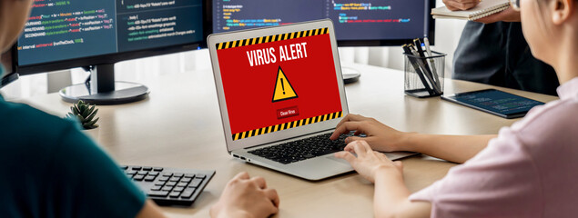 Virus warning alert on computer screen detected brisk cyber threat , hacker, computer virus and...