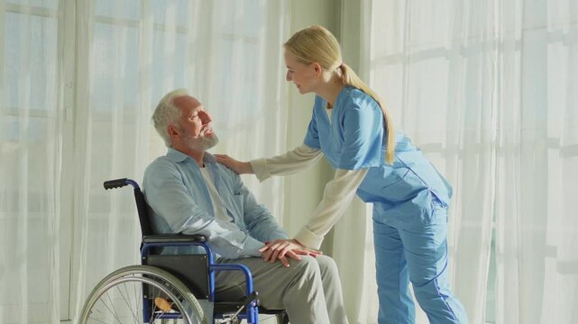 Help support retirement healthcare. Nurse helping old man in wheelchair. Patient and woman in nursing home for medical caregiver. Nurse taking care of paralyzed man in chair for people with disability