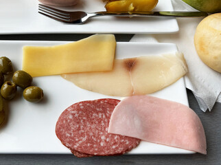 Slices of sausage, ham and cheese. Close-up, top view