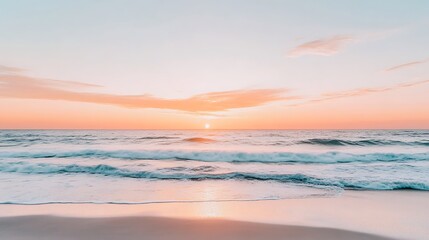 Obraz premium A serene beach at sunset with the sky painted in shades of pink and orange, gentle waves, and a cool breeze