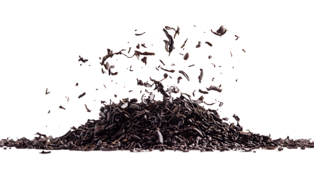 A pile of coffee grounds is scattered on a white background. Concept of chaos and disorder, as the coffee grounds are spread out in a haphazard manner