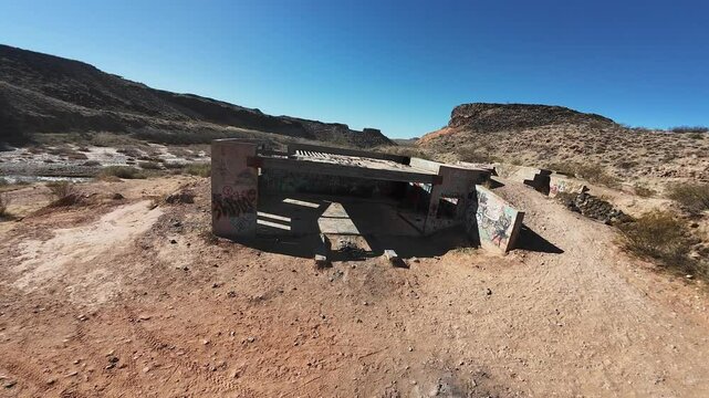Virgin River- Hurricane, Utah, USA - February 10, 2025: Aerial-FPV-Flying around the graffiti covered foundation remains of the never-completed Babylon House in the Virgin River bottoms