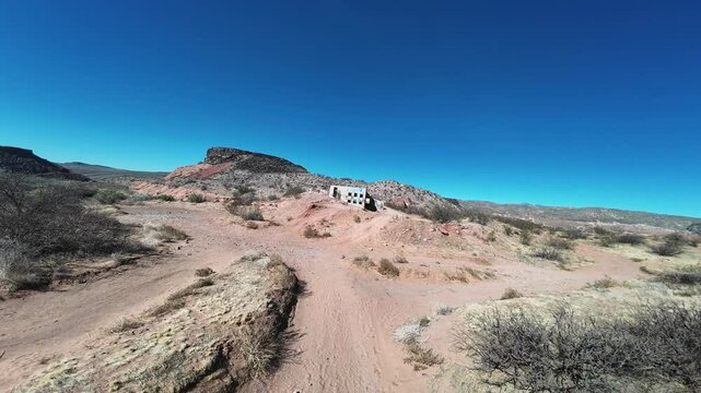 Virgin River - Hurricane, Utah, USA - February 10, 2025: Aerial-FPV-Graffiti covered concrete foundation of the Babylon House. The house burned to the foundation before completion and was abandoned