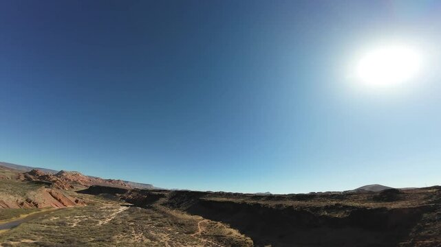Virgin River Gorge- Hurricane, Utah, USA - February 10, 2025: Aerial-FPV-Climbing over basalt cliff-Flying over rim of the gorge-Passing over cliff top homes in a subdivision of Hurricane